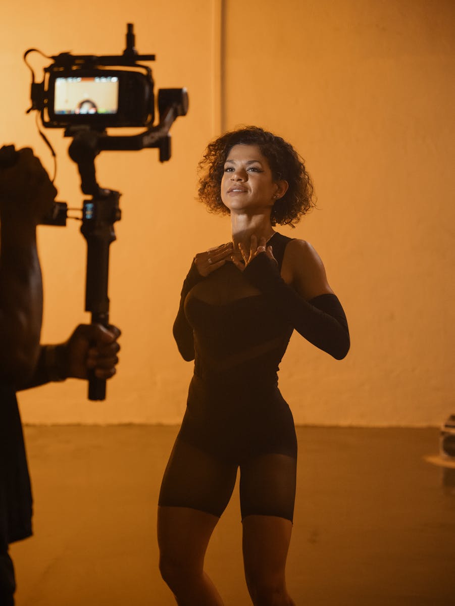 Female Fashion Model Posing in Front of a Movie Camera